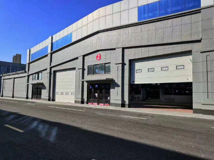 Porte industriali a sezione a carico superiore personalizzabili resistenti alle intemperie